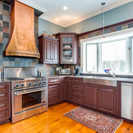 Custom Kitchen view with a unique hood feature