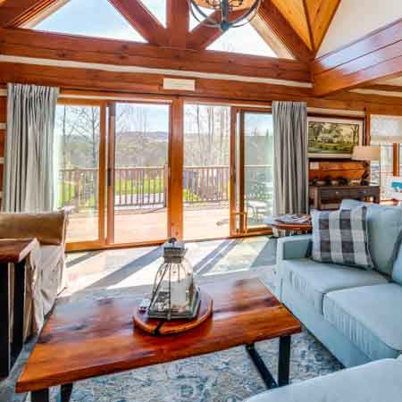 Warm and inviting chalet couch and large views to backyard.