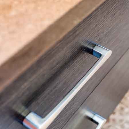 Close up view on a handle of a drawer in a bathroom