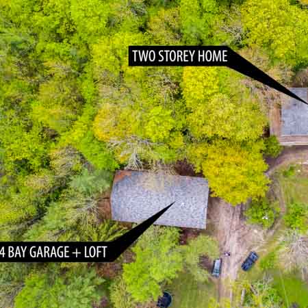 aerial view with a drone directly overhead a house and garage for real estate