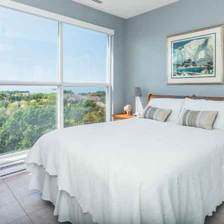 Bedroom with floor to ceiling windows