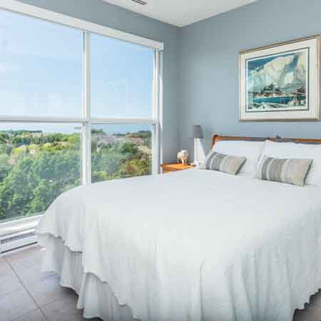 Bedroom with floor to ceiling windows