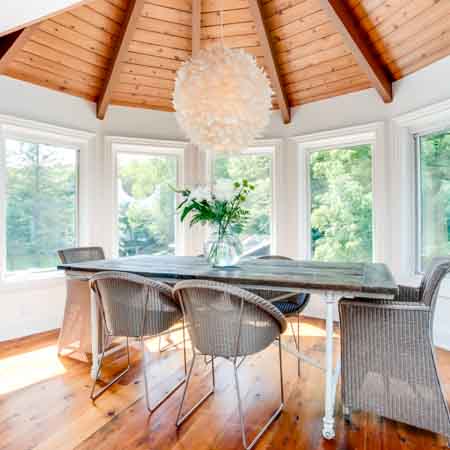 Bright dining room in room with a curved wall